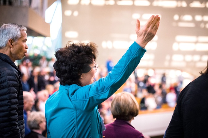 Woman raising her hand