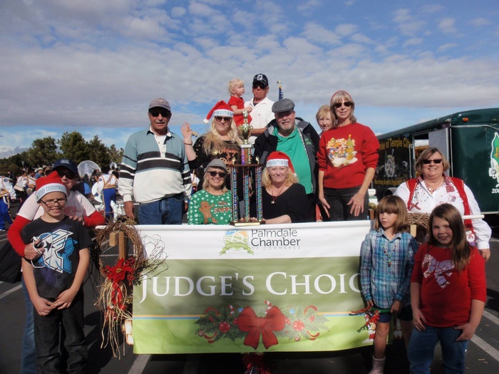 Group of people standing with sign that says "Judge's Choice"