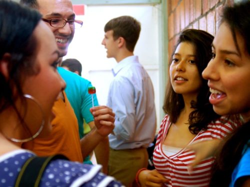 Group of people standing together talking