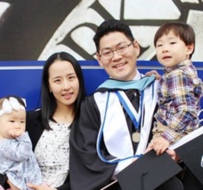 Korean parents with their two children
