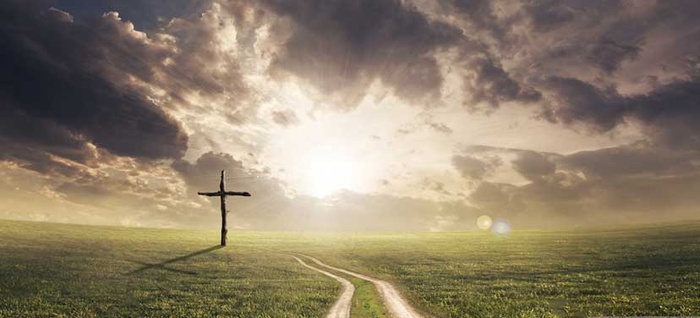 Grass with path down the middle and cross on the grass
