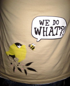 Tshirt showing a cartoon image of a bird and a bee saying "we do what?"