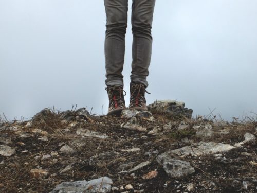 Hiker standing on hill